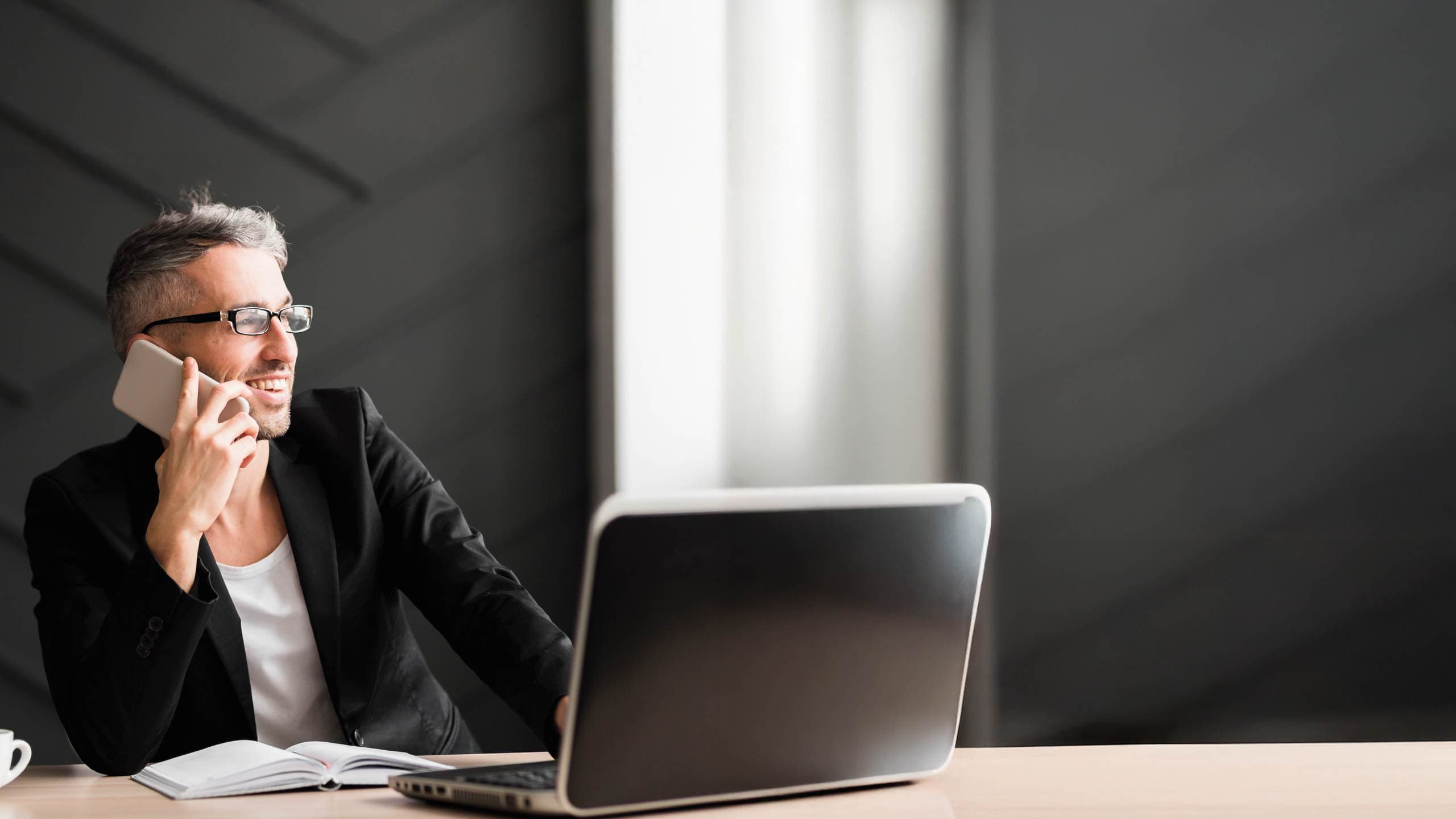 Professional on phone in modern office